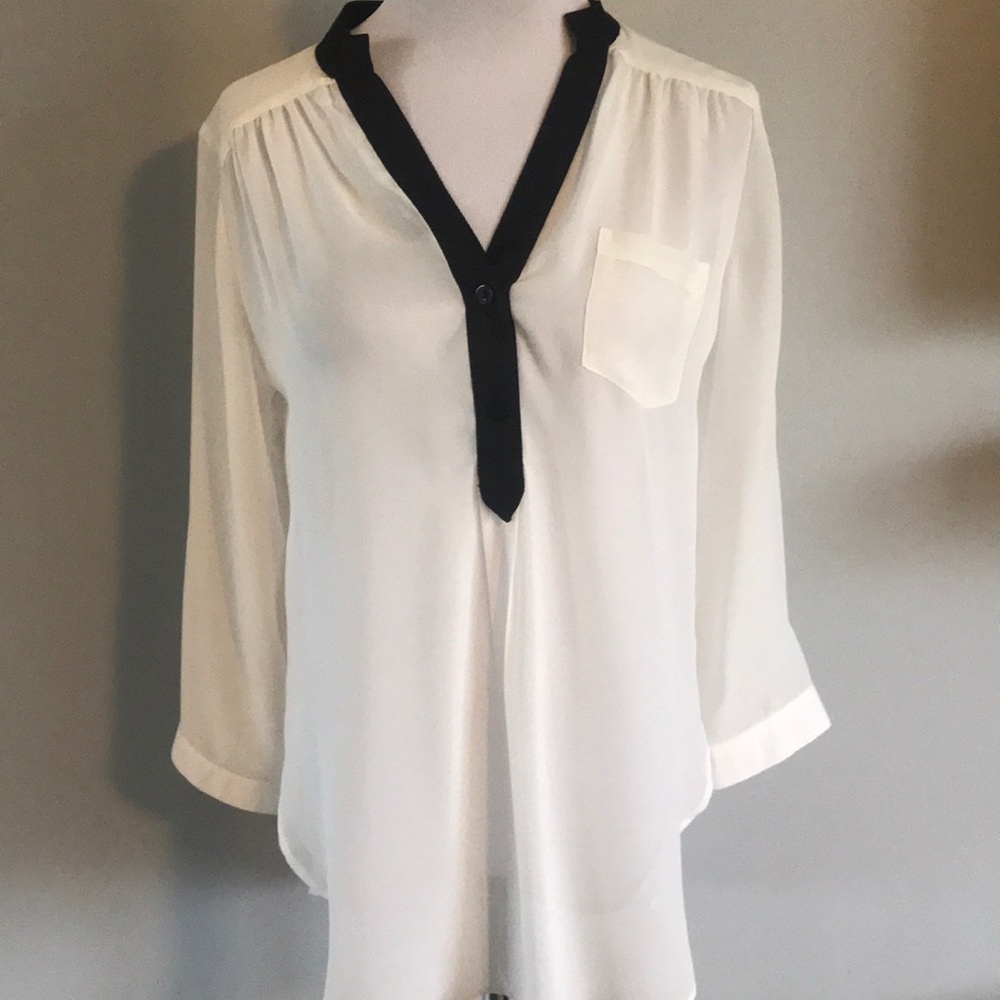White blouse with black trim
